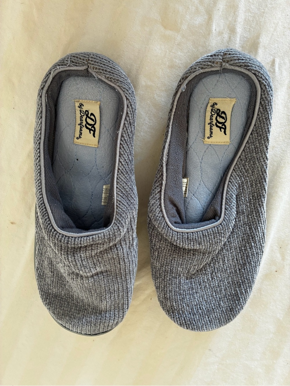 Well worn Women’s Dearfoam house slippers